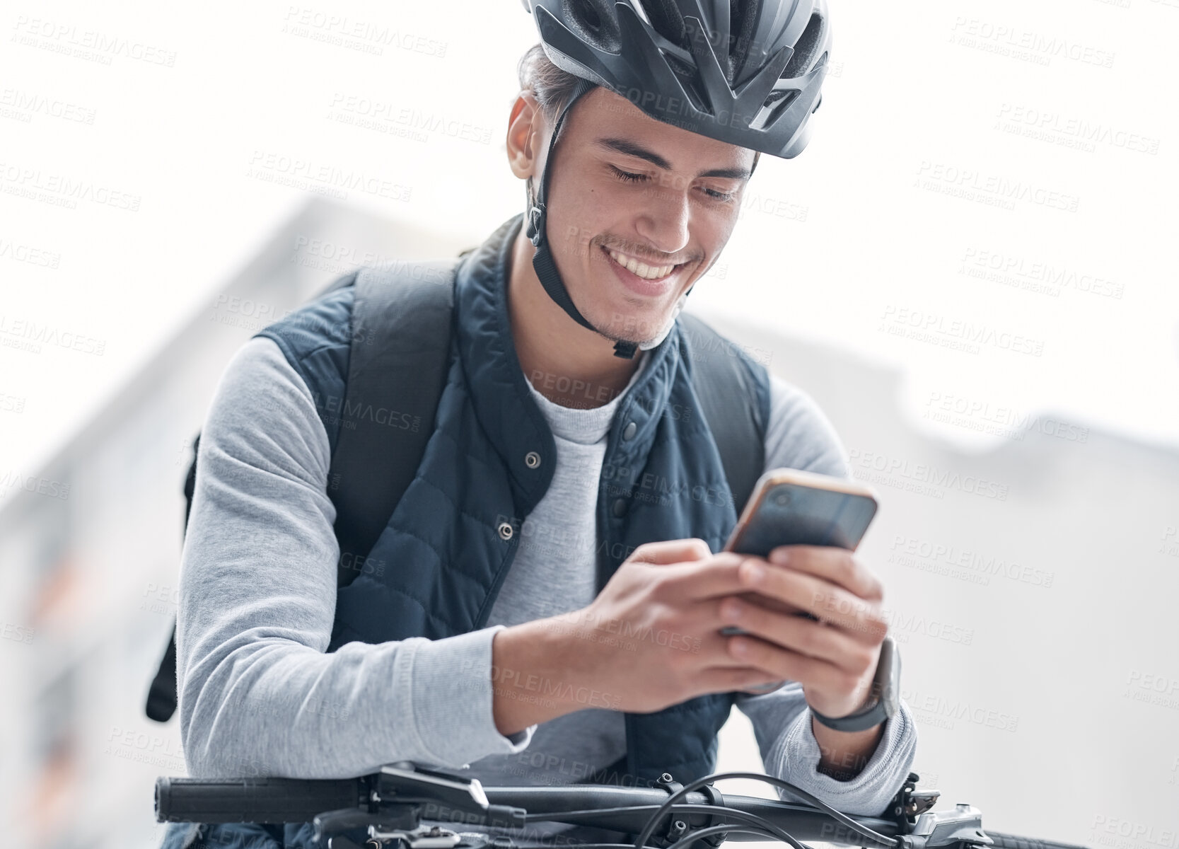 Buy stock photo Delivery, bike travel or man with phone in city, street or road for GPS, location or networking outdoor. Smile, helmet or male with smartphone  app for communication, social media or 5g network