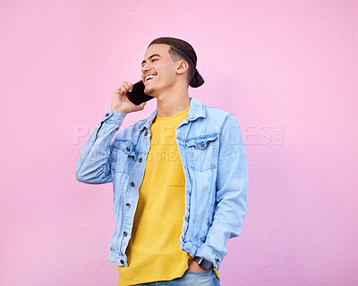 Buy stock photo Phone call, smile and communication, gen z man talking and happy isolated on pink background. Smartphone, urban fashion and networking, happy male model in conversation on cellphone with technology.