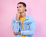 Idea, inspiration and man thinking of a plan isolated on a pink background in a studio. Future, motivation and person planning in his mind, fantasy thoughts and visualization image on a backdrop