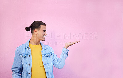 Buy stock photo Happy, hand and of a man in a studio with mockup space for advertisement, product placement or marketing. Happiness, smile and male model showing mock up or copyspace isolated by a pink background.