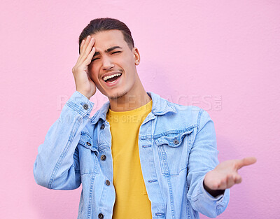 Confused, portrait and man with a headache pain isolated on a pink background in a studio. Mental health, tired and sad person with a question, frustrated and stress from a poblem on a backdrop