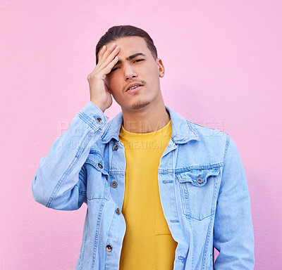 Buy stock photo Stress, portrait and man with headache in studio isolated on a pink background. Mental health, anxiety and face of depressed and sad male model with depression, pain or migraine, burnout or emoji.