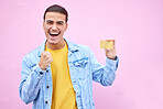 Man, portrait and excited in celebration with credit card for discount, sale or bonus in ecommerce on mockup. Happy male celebrating cash, profit or salary increase against a pink studio background