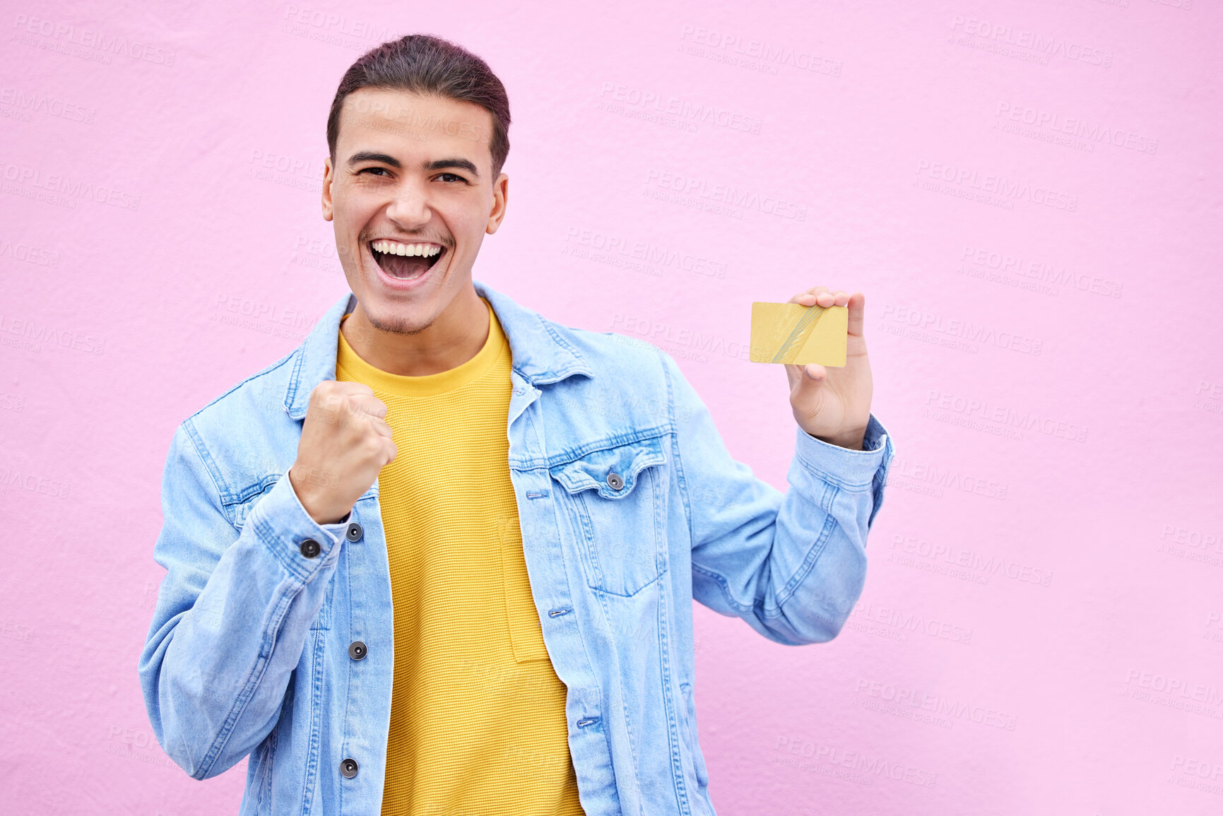 Buy stock photo Man, portrait and excited in celebration with credit card for discount, sale or bonus in ecommerce on mockup. Happy male celebrating cash, profit or salary increase against a pink studio background