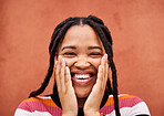 Happy, laughter and portrait with a black woman on an orange background outdoor for joy or humor. Funny, laugh and smile with an african american person laughing or joking against a color wall