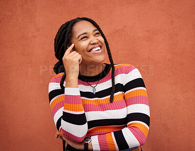 Buy stock photo Happy, thinking and black woman on mockup in studio, idea and laughing on orange background. Contemplating, emoji and girl in positive, mindset and decision on wall, advertising or product placement