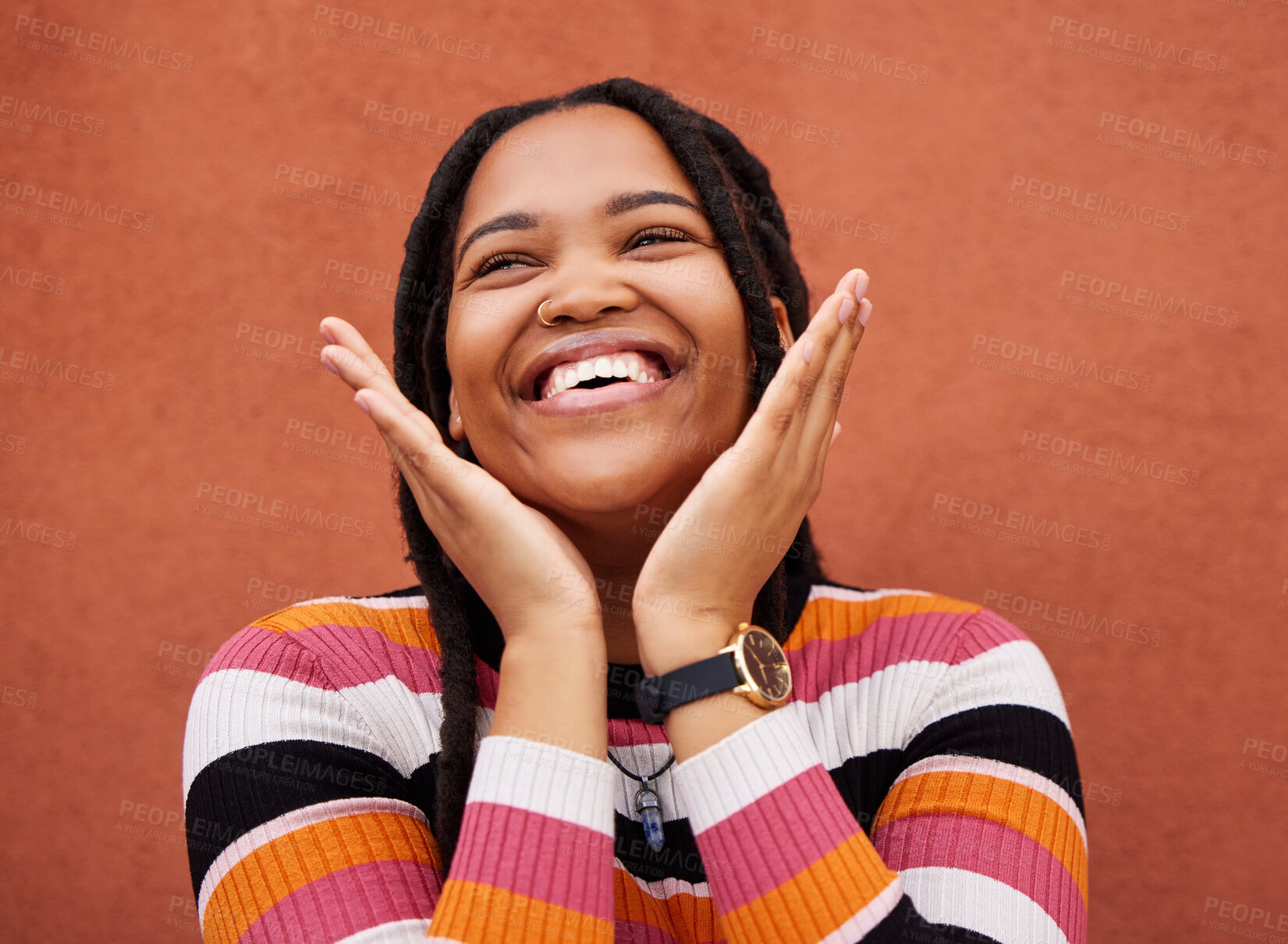 Buy stock photo Happy, laugh and freedom with a black woman on an orange background outdoor for joy or humor. Funny, laughter and smile with an african american person laughing or joking against a color wall