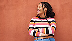 Mockup, proud and black woman relax on orange wall background for advertising, space and marketing. Happy, smile and girl in good mood, positive and mindset isolated on product placement in studio