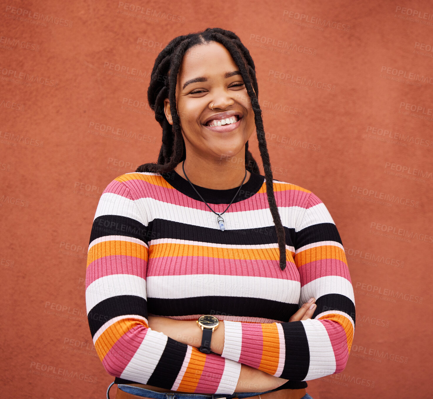 Buy stock photo Happy, smile and portrait of a black woman by a wall in city while walking for adventure. Happiness, freedom and African female posing with crossed arms in a town on holiday, vacation or weekend trip