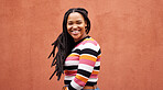 Portrait, wall and black woman with smile, fashion and freedom with joy, success and casual outfit. Face, Jamaican female and happy lady on background, happiness and cheerful with wonder and mockup