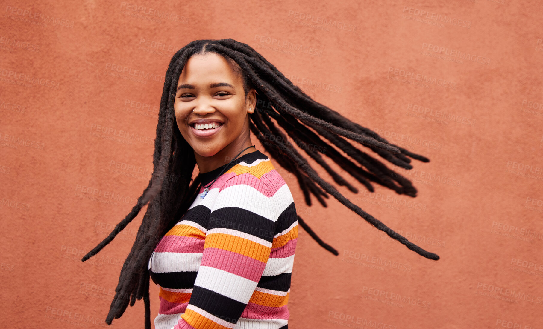 Buy stock photo Playful, fun and portrait of a black woman with a smile isolated on a studio background. Happy, laughing and a funny young African girl with dreadlocks, happiness and expression on a backdrop