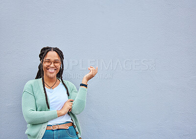 Buy stock photo Mockup, portrait and black woman pointing to space for advertising, empty or grey wall background. Face, gesture and girl relax, happy and smile in studio on product placement, isolated or copy space