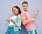 Dance, happy and playful couple with air guitar for comedy isolated on a grey studio background. Excited, crazy and interracial man and woman playing and dancing with an imaginary instrument