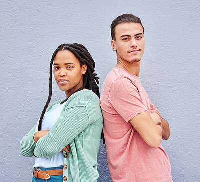 Buy stock photo Diversity, friends and portrait of man and black woman standing together at wall background. Confidence, friendship and trendy creative gen z couple or students in studio with motivation and mock up.