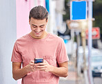 Man, cellphone and typing in city for social media, technology and iot networking. Happy young guy walking in urban street with smartphone, connection and reading notification of online internet post
