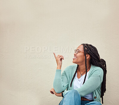 Buy stock photo Black woman, happy and hands pointing to mockup, advertising or empty background, laugh and excited. Hand gesture, smile and girl relax in studio while showing wall copy space for isolated marketing