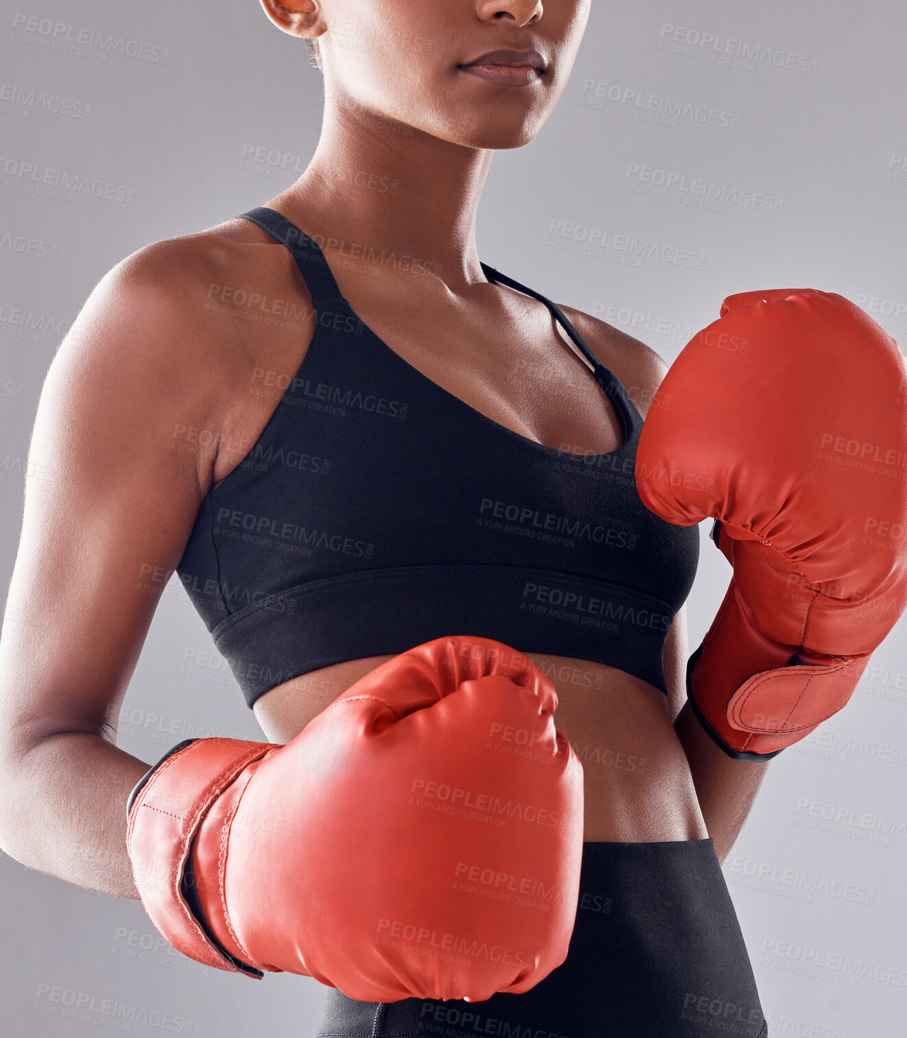 Buy stock photo Boxing, fitness gloves and woman in studio for sports exercise, strong muscle or mma training. Female boxer, workout and fist fight for impact, energy and warrior power in battle, challenge or action