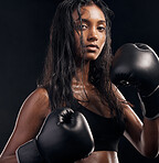 Boxer, gloves and portrait of woman on black background for sports, strong focus or mma training. Female boxing, workout or fist fight of impact, energy and warrior power for studio fitness challenge