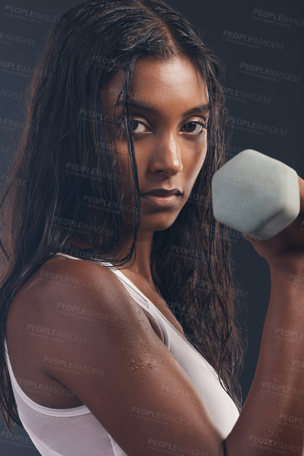 Buy stock photo Woman, portrait and exercise with dumbbell on black background, strong body and focus mindset. Indian female, bodybuilder and studio weights for fitness, power training and energy for sports workout