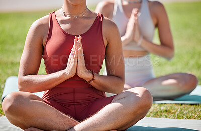 Buy stock photo Yoga, class and praying hands of women for zen fitness, exercise and mindfulness, healing and peace in park grass. Meditation, spiritual and calm people, prayer or namaste for body wellness together