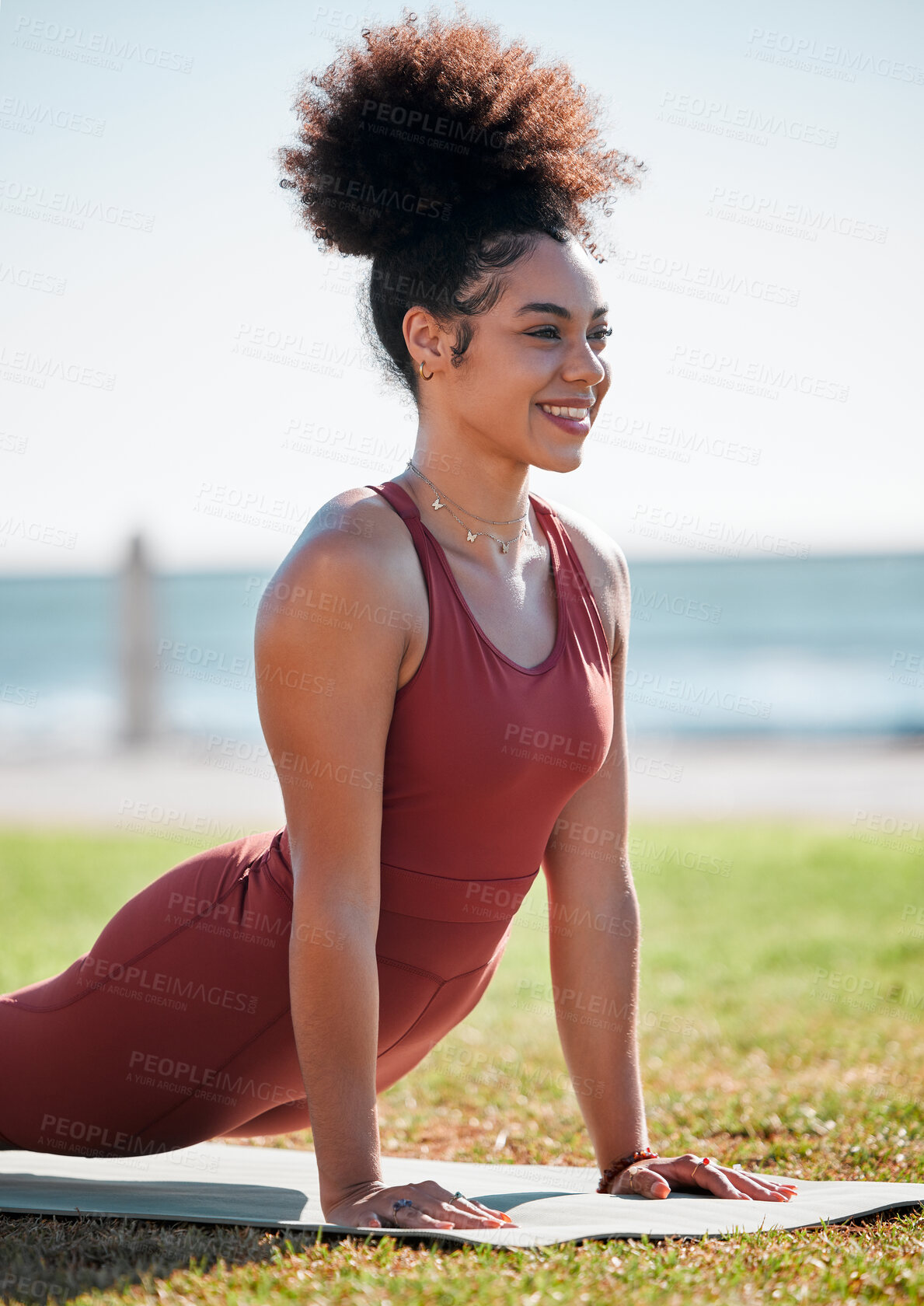 Buy stock photo Yoga, pilates and black woman stretching on grass for healthy lifestyle, body wellness and cardio workout. Sports, fitness and girl doing meditation training, cobra stretch and exercise for peace