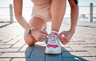 Buy stock photo Closeup, fitness and woman tie shoes, training and exercise for wellness, health and performance. Zoom, female athlete and lady with tying shoes, ready for marathon and run for cardio and energy 