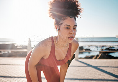 Buy stock photo Exercise, music and tired with a black woman runner on the promenade for cardio or endurance training. Fitness, running and earphones with a sports person feeling exhausted during her workout