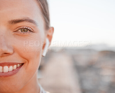 Buy stock photo Half portrait, fitness and music with a sports woman outdoor, standing against a mockup sky background. Face, exercise and wellness with a female athlete cardio or endurance training alone outside