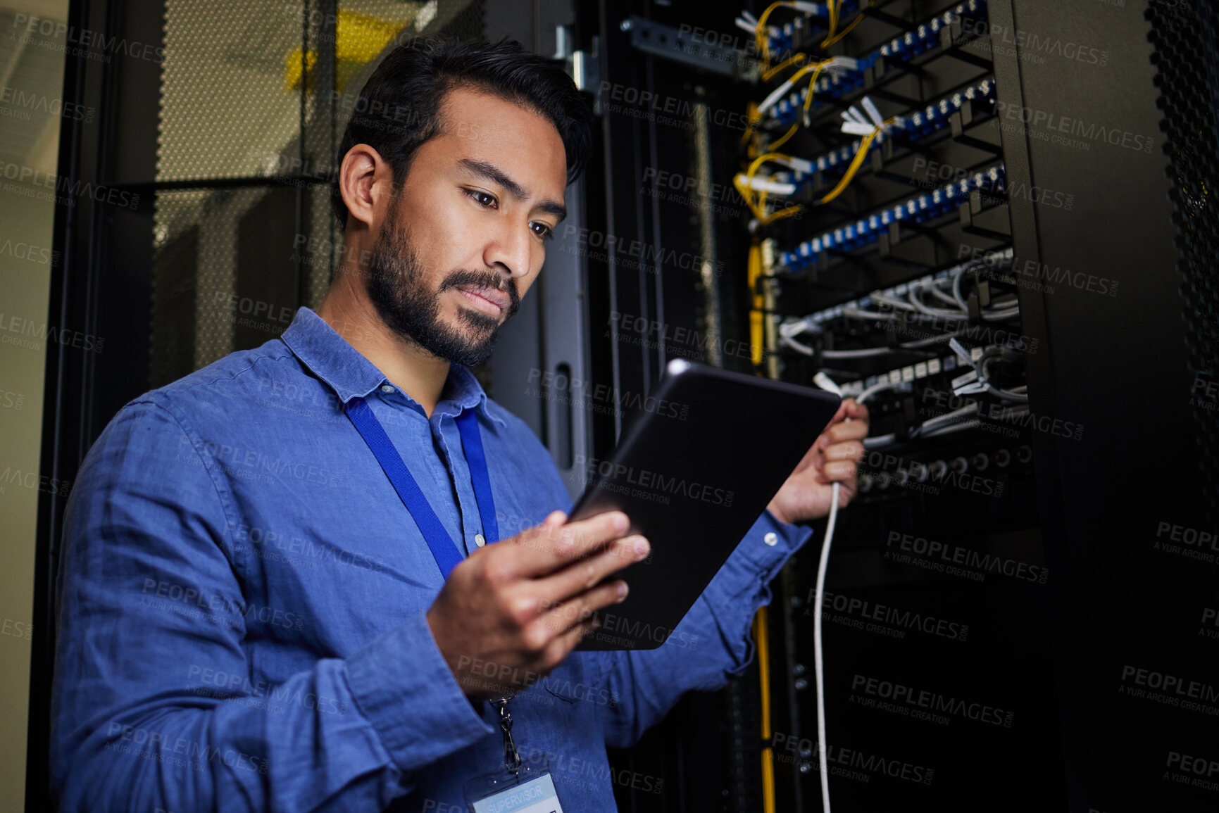 Buy stock photo Server room, tablet and engineer with connection cable for maintenance or software update at night. Cybersecurity, it programmer and coder man with technology for database networking in data center.