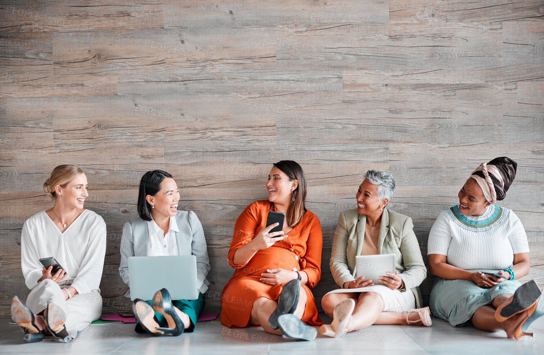 Buy stock photo Collaboration, technology and mockup with a business team sitting on the floor, meeting in their office for work. Teamwork, diversity and corporate design with a woman employee group working together