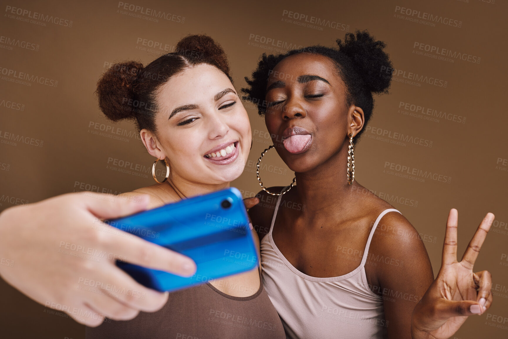 Buy stock photo Fashion, selfie and friends with phone with peace sign on brown background for wellness, cosmetics and makeup. Jewellery, happy and girls smile on smartphone for social media, picture and online post