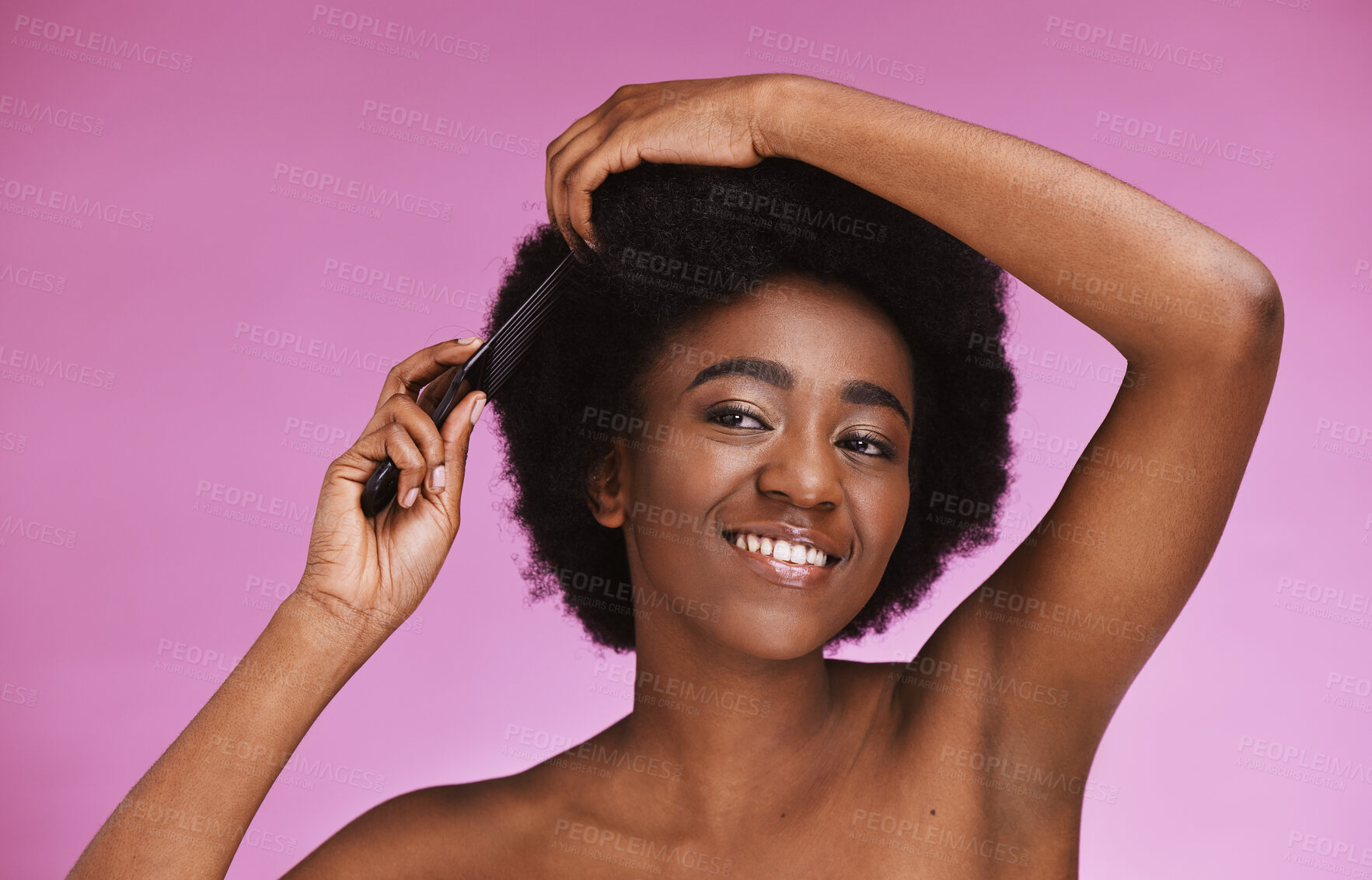 Buy stock photo Black woman, hairstyle and afro brush on beauty studio background in grooming routine, texture maintenance or wellness. Happy model, comb and natural hair growth with skincare makeup on isolated pink