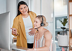 Call center, coaching and pointing at computer in office with pregnant woman, smile and learning at desk. Women, happy manager and desktop with tech support, customer service and workplace education