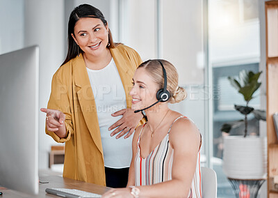 Buy stock photo Call center, coaching and pointing at computer in office with pregnant woman, smile and learning at desk. Women, happy manager and desktop with tech support, customer service and workplace education