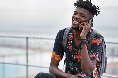 Buy stock photo Phone call, communication and black man with a cellphone in the city while on an adventure. Happy, smile and African male on a mobile conversation with smartphone in town on a holiday or weekend trip