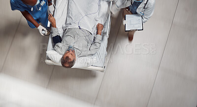 Buy stock photo Hospital bed, icu healthcare and doctor with patient in a medical clinic from above. Emergency, wellness team and man going into surgery for injury, health care check or wellness consultation