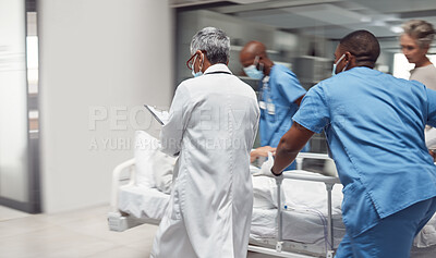Buy stock photo Busy, healthcare and doctors rush with patient, surgery and ready for procedure in hospital. Fast team, medical professional and staff with emergency, accident and health with wellness and nurses