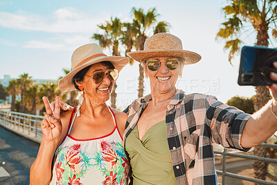 Buy stock photo Women, peace selfie and holiday smile in Miami with happiness from summer travel and vacation. Beach, web connection and mobile of mature friends by the sea with happiness on 5g for social media