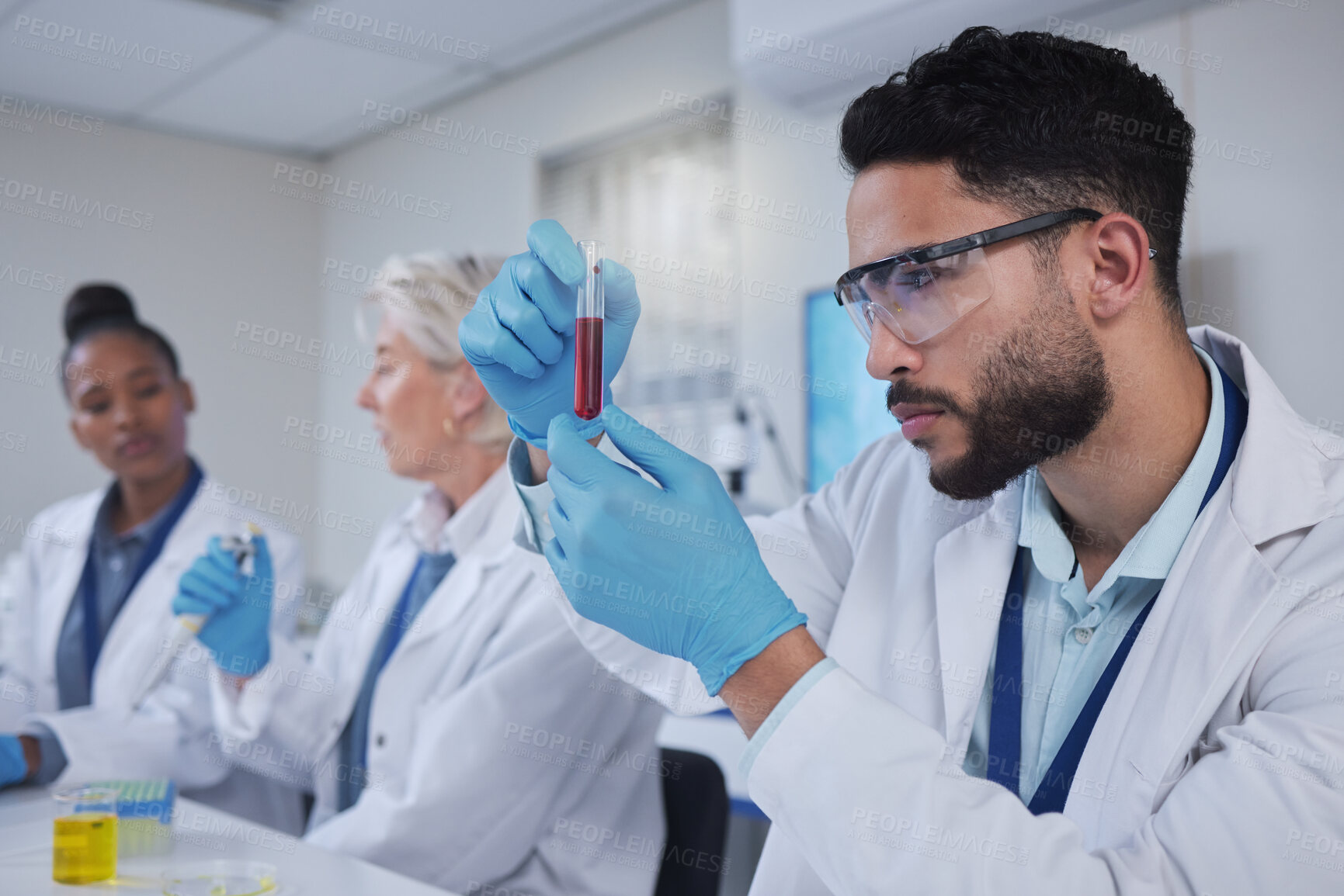 Buy stock photo Science, laboratory and team with blood in test tube for medical research, investigation or dna testing. Biotechnology, forensic lab and scientists with fluid sample for analysis, study or experiment