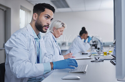 Buy stock photo Typing, focus scientist working on computer in lab for medical search, innovation or science study in hospital. Medicine, internet or group of doctors on tech for healthcare or wellness DNA research