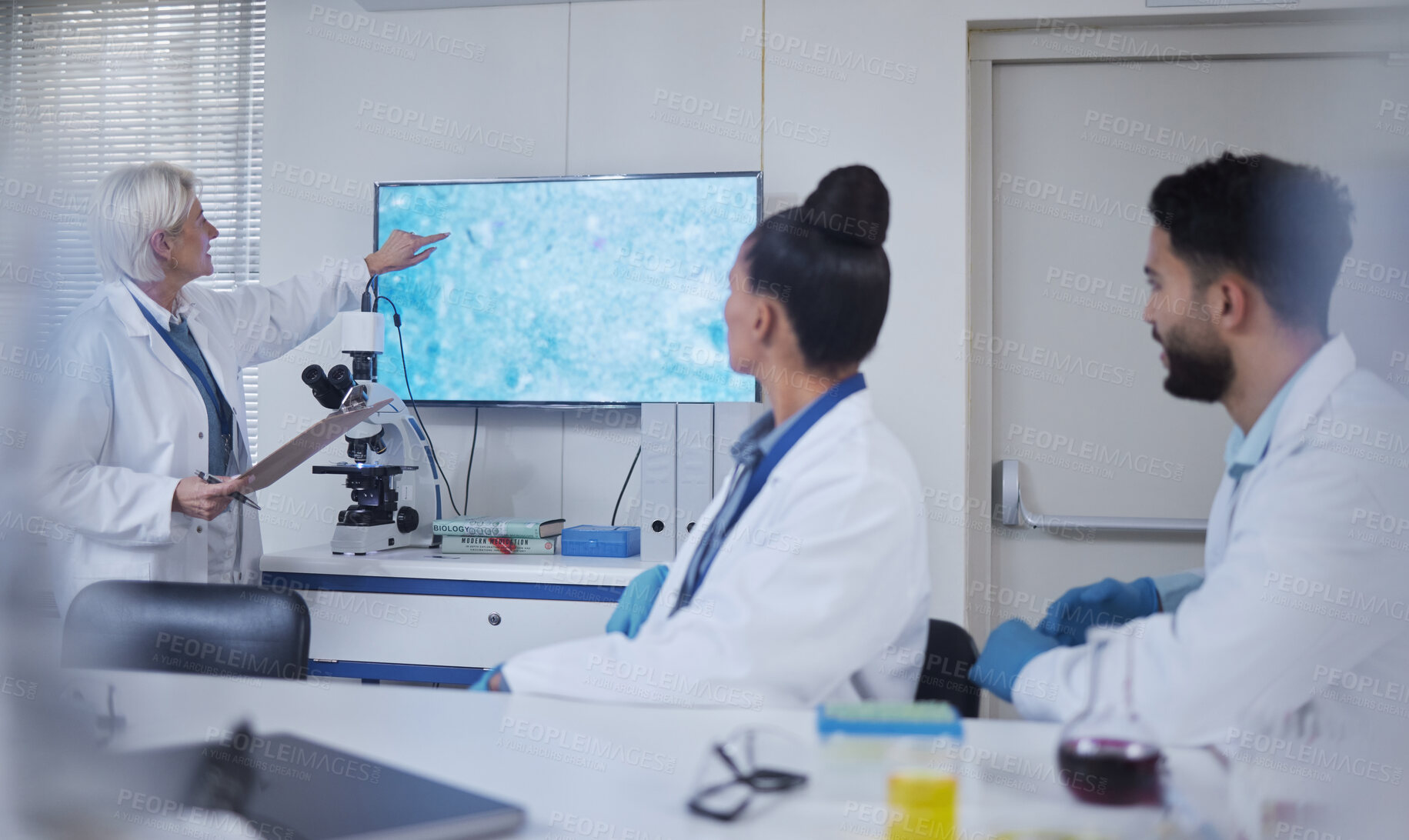 Buy stock photo Presentation, science and scientist speaker in the laboratory meeting, training or seminar. Innovation, leadership and senior female researcher presenting discovery to her team with technology in lab