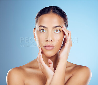 Buy stock photo Woman feel face for beauty, skincare and blue background of wellness, cosmetics and salon spa results. Portrait, facial and studio model with healthy aesthetic, laser dermatology and natural makeup 