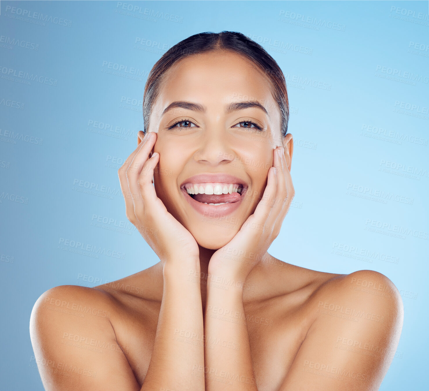 Buy stock photo Skincare, beauty and woman with tongue out in studio for makeup, cosmetics and wellness. Happy model, portrait smile and clean teeth whitening for aesthetics, facial salon and glow on blue background