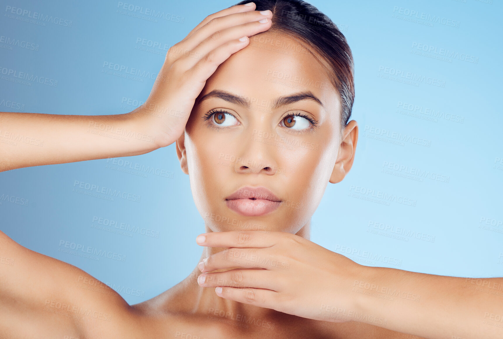 Buy stock photo Face, hands and woman skincare on blue background for beauty, wellness and cosmetics from salon spa. Makeup, facial and studio model with dermatology of healthy aesthetic, laser results or clean glow