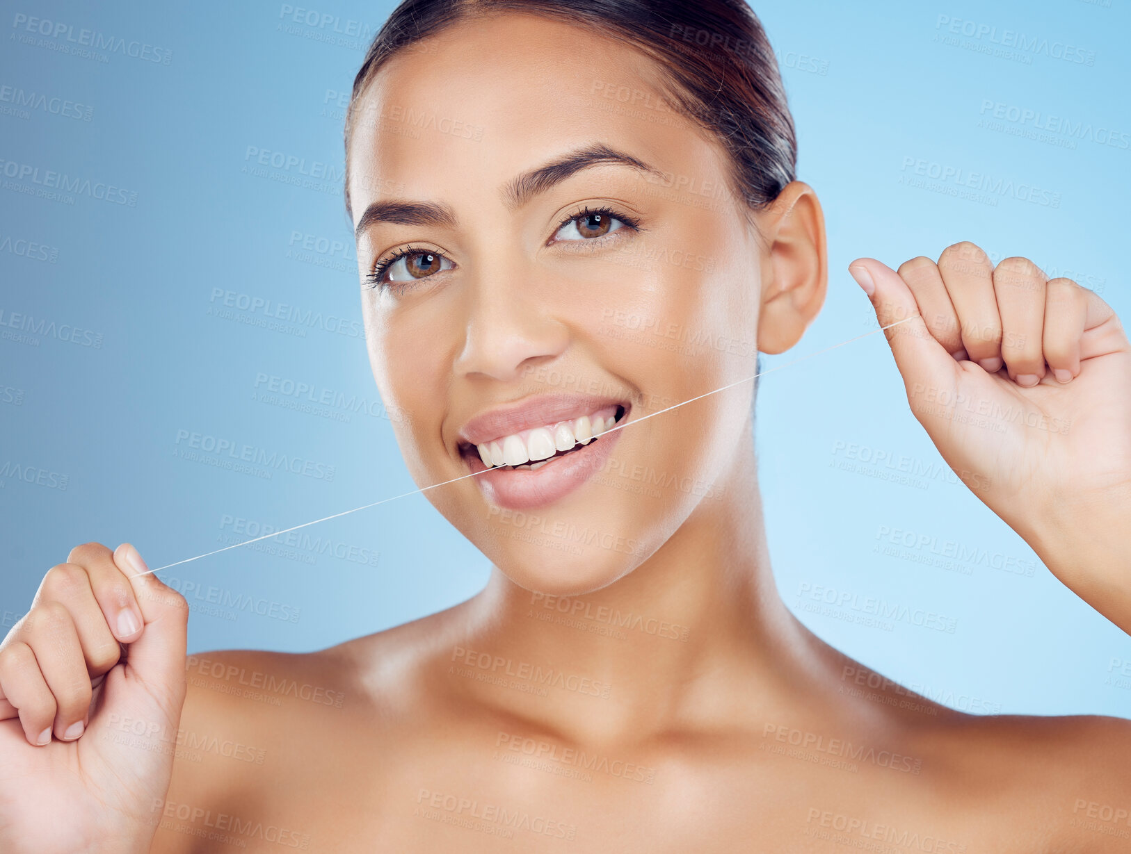 Buy stock photo Floss, teeth and portrait of woman in studio for beauty, healthy body and hygiene on blue background. Female model, tooth flossing and cleaning mouth for facial smile, fresh breath and happy dental