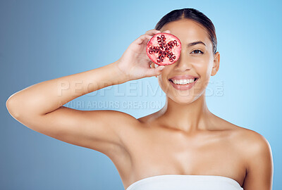 Buy stock photo Pomegranate facial, woman and portrait for beauty, skincare wellness and studio background. Happy model, smile face and red fruit seeds of natural cosmetics, detox nutrition and aesthetic dermatology