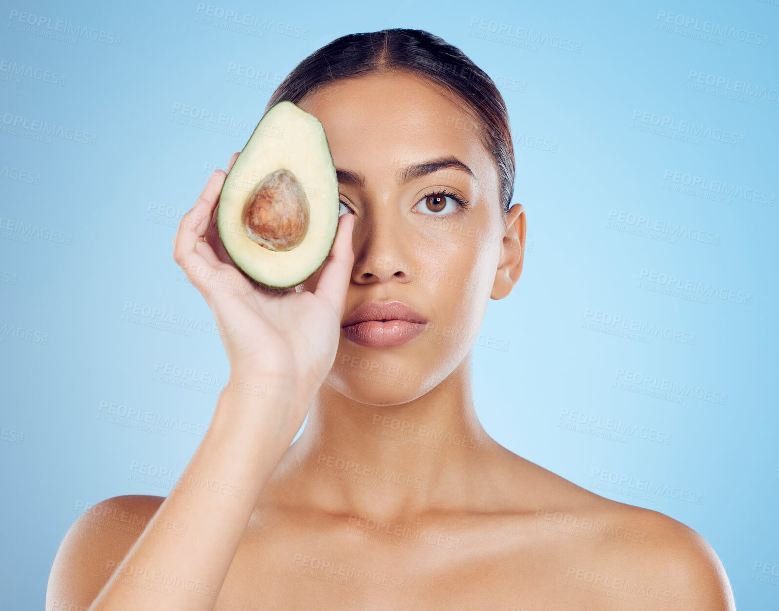 Buy stock photo Avocado wellness, studio portrait and woman with healthy skincare for face, beauty and vegan makeup. Model, green fruits and natural cosmetics for detox, facial nutrition and aesthetic glow benefits