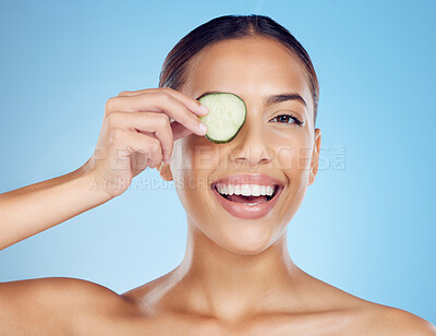 Buy stock photo Cucumber, woman and portrait of smile for skincare, face beauty and wellness diet on studio background. Happy model, eyes and green fruits cosmetics for detox, facial nutrition and aesthetic benefits