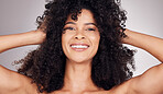 Skincare, happy or portrait of black woman in studio with natural hair, cosmetic and face routine. Health smile, beauty or girl model from Puerto Rico for facial wellness isolated by gray background