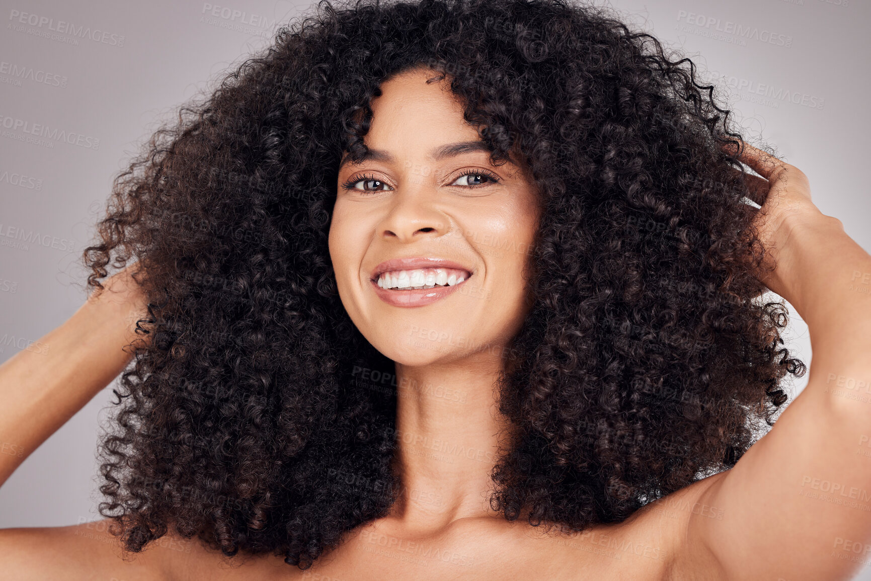 Buy stock photo Portrait, beauty and afro with a model black woman in studio on a gray background for natural hair or skincare. Face, salon or Brazil girl happy with smile for health, beauty or facial treatment 